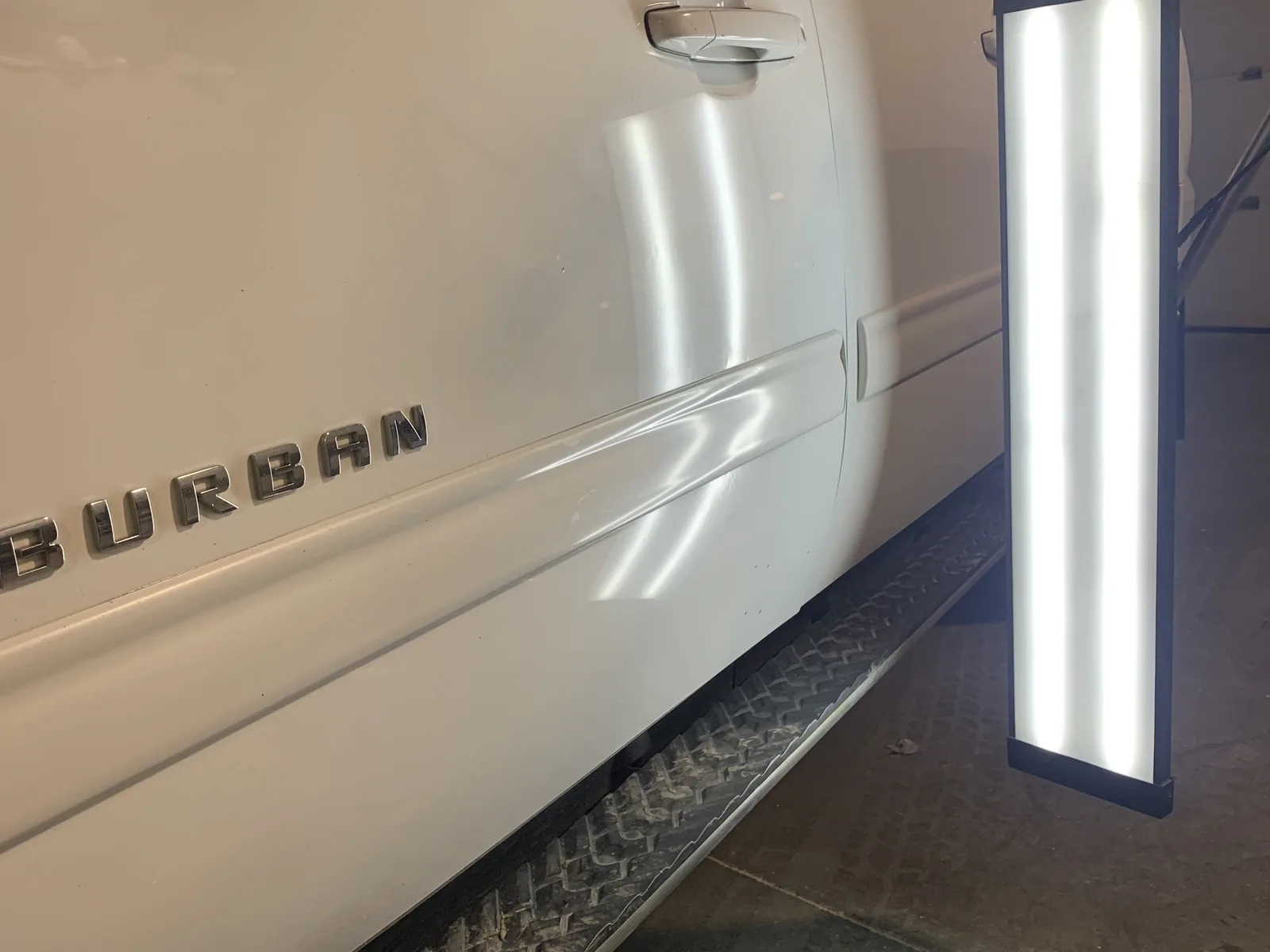Chevrolet Suburban door after paintless dent repair by SFR