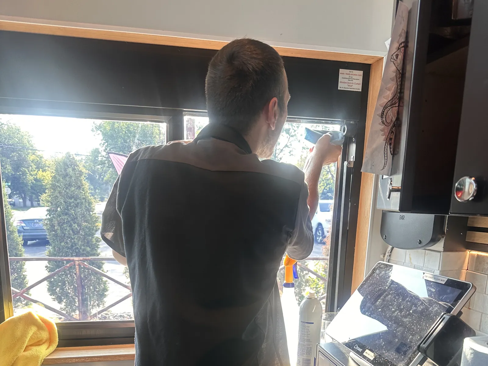 SFR technician installing commercial window film for a Billings, MT business