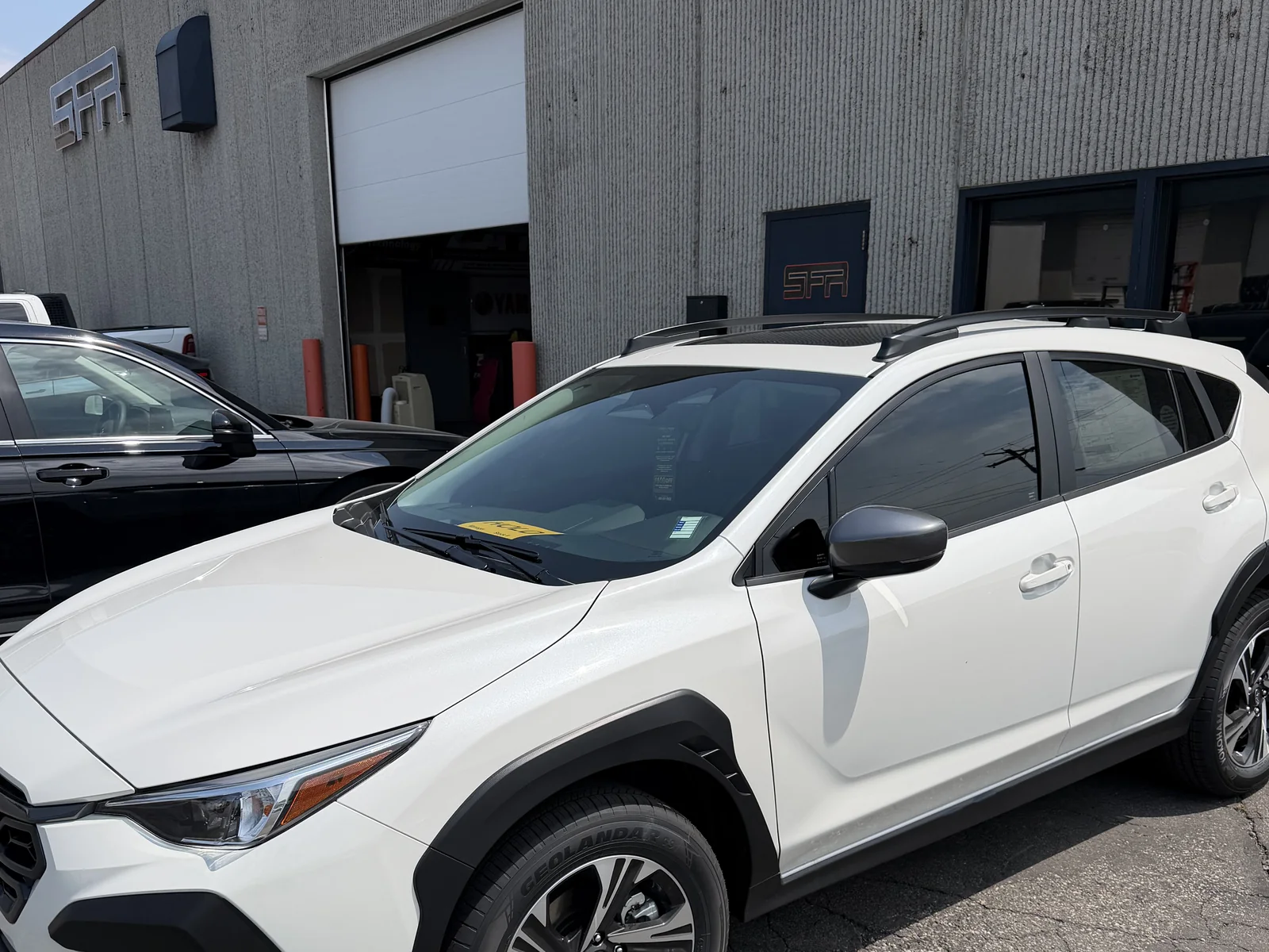 Subaru Crosstrek side profile — window tint pops on white paint, by SFR Tint & PDR