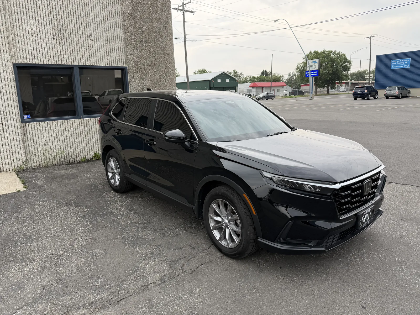 Black Honda CR-V side profile with window tint by SFR Tint & PDR