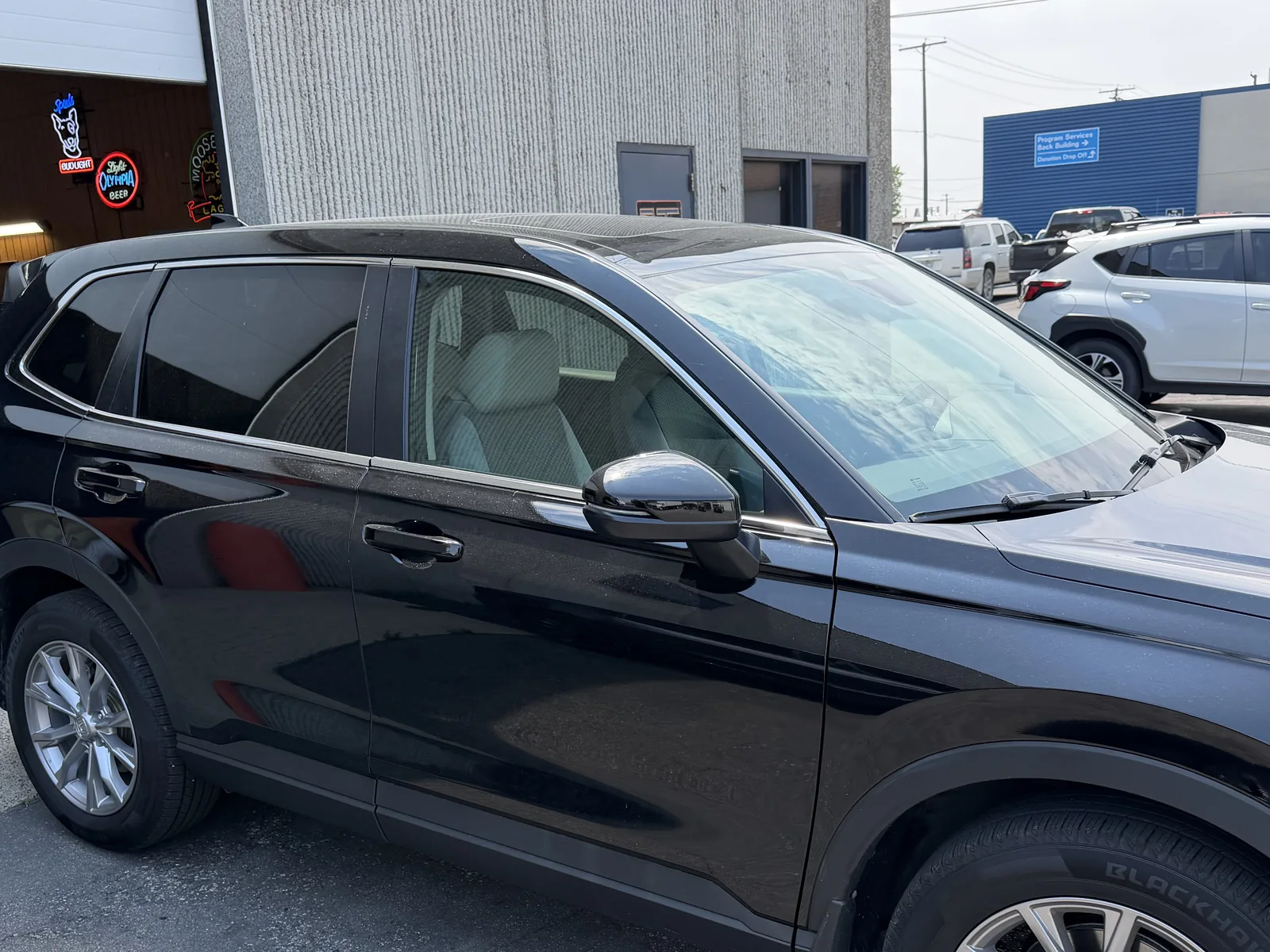 Black Honda CR-V tinted side windows close-up by SFR Tint & PDR